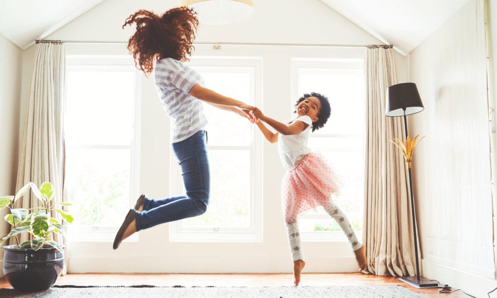 mom and daughter jumping