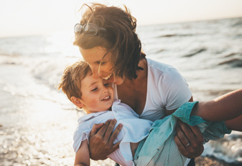 mom with son on beach