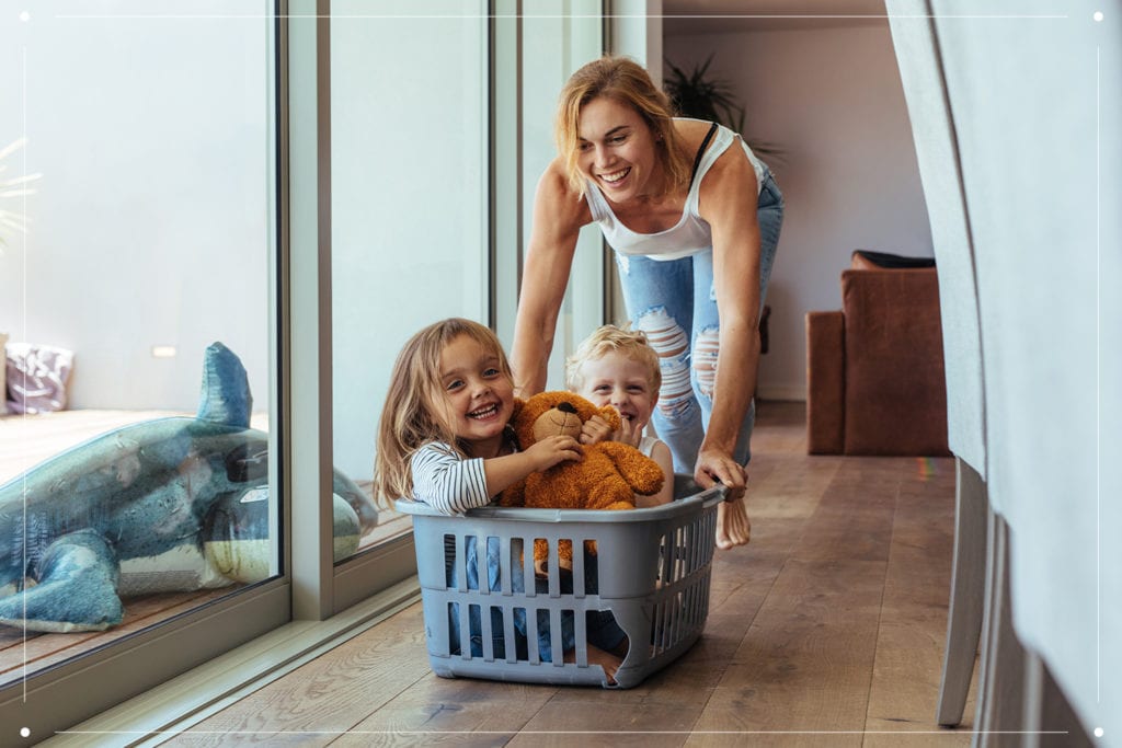 mom pushing kids in basket